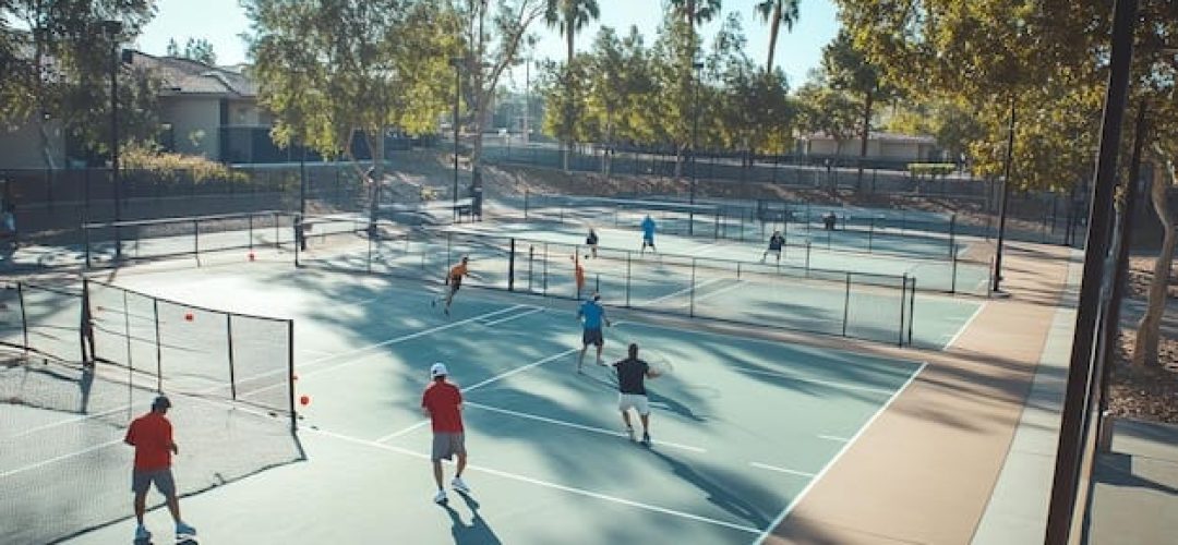 [freepicdownloader.com]-group-people-playing-tennis-outdoor-courts-normal